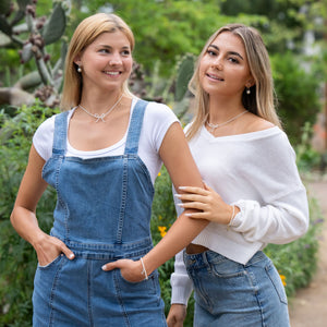 Delicate and timeless, the Pearls & Bow Bracelet features a hand-shaped brass bow paired with dainty faux pearls, creating a piece that adds elegance and charm to any look. The bow symbolizes resilience and the strength of lives beautifully tied together.
Handcrafted by a young woman escaping human trafficking in India, each bracelet carries a story of hope, dignity, and new beginnings. Your purchase supports her journey through our non-profit, International Sanctuary.