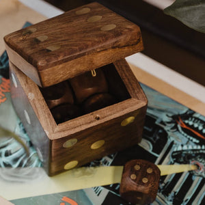 wooden dice box and dice