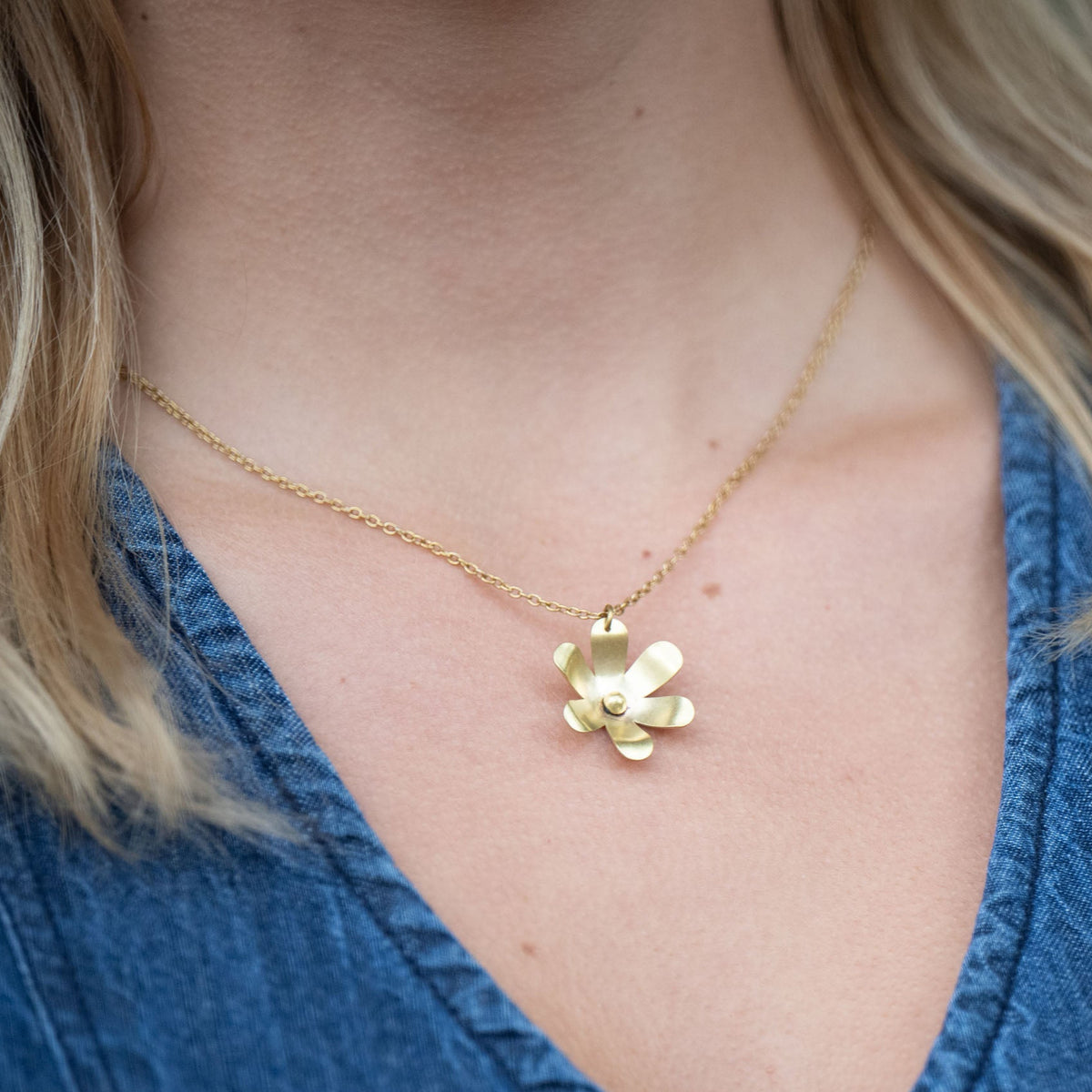 In Victorian floriography, buttercups symbolize childlike joy and innocence. Each buttercup is carefully hand-cut and shaped with love, creating a necklace that adds sophistication to your daytime look and a spark to your evening attire. The design also symbolizes resilience and the ability to flourish even through challenges.

Hand-cut and shaped by a young woman escaping human trafficking in India, your purchase brings hope, dignity, and a brighter future to the artisan 