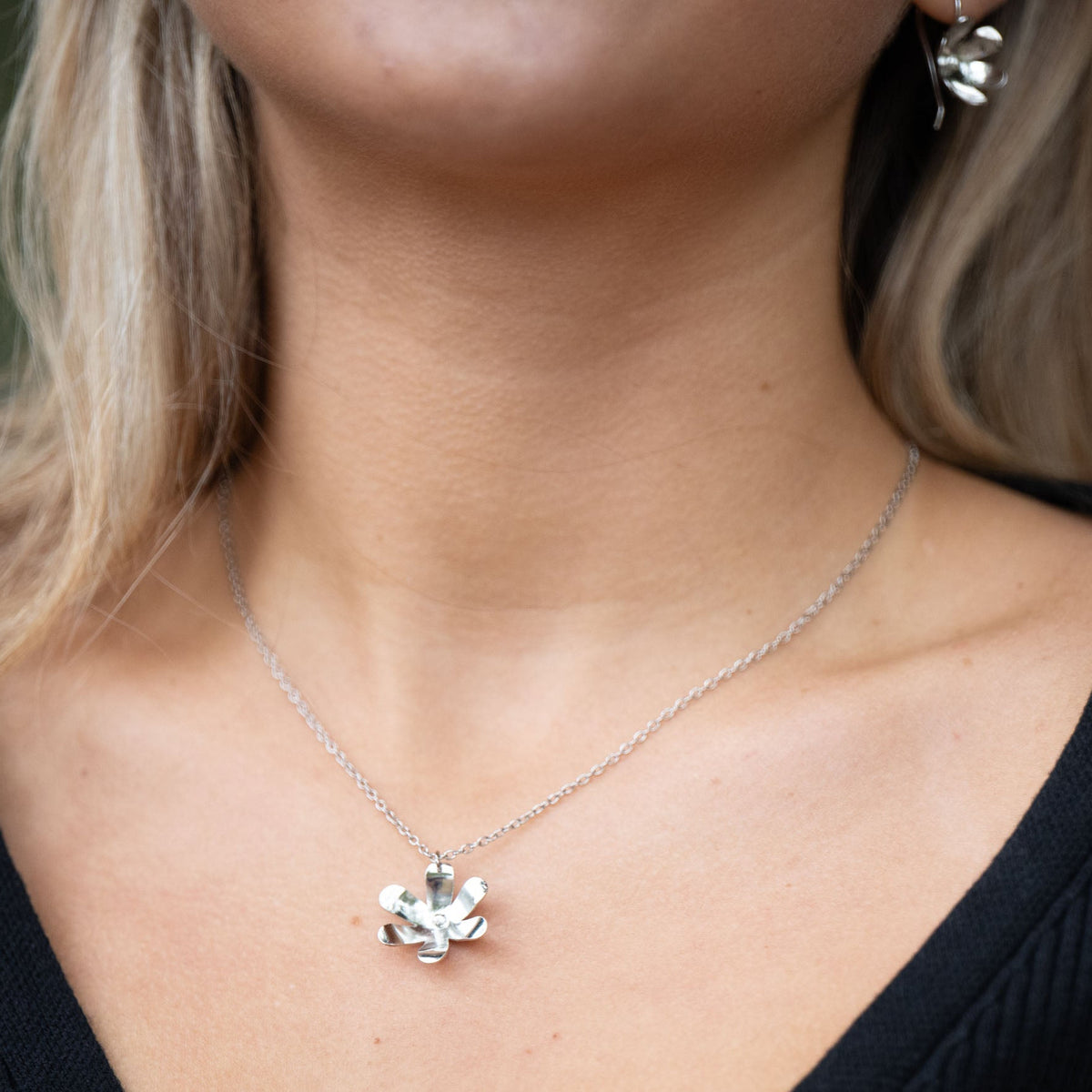 n Victorian floriography, buttercups symbolize childlike joy and innocence. Each buttercup is carefully hand-cut and shaped with love, creating a necklace that adds sophistication to your daytime look and a spark to your evening attire. The design also symbolizes resilience and the ability to flourish even through challenges.

Hand-cut and shaped by a young woman escaping human trafficking in India, your purchase brings hope, dignity, and a brighter future to the artisan 