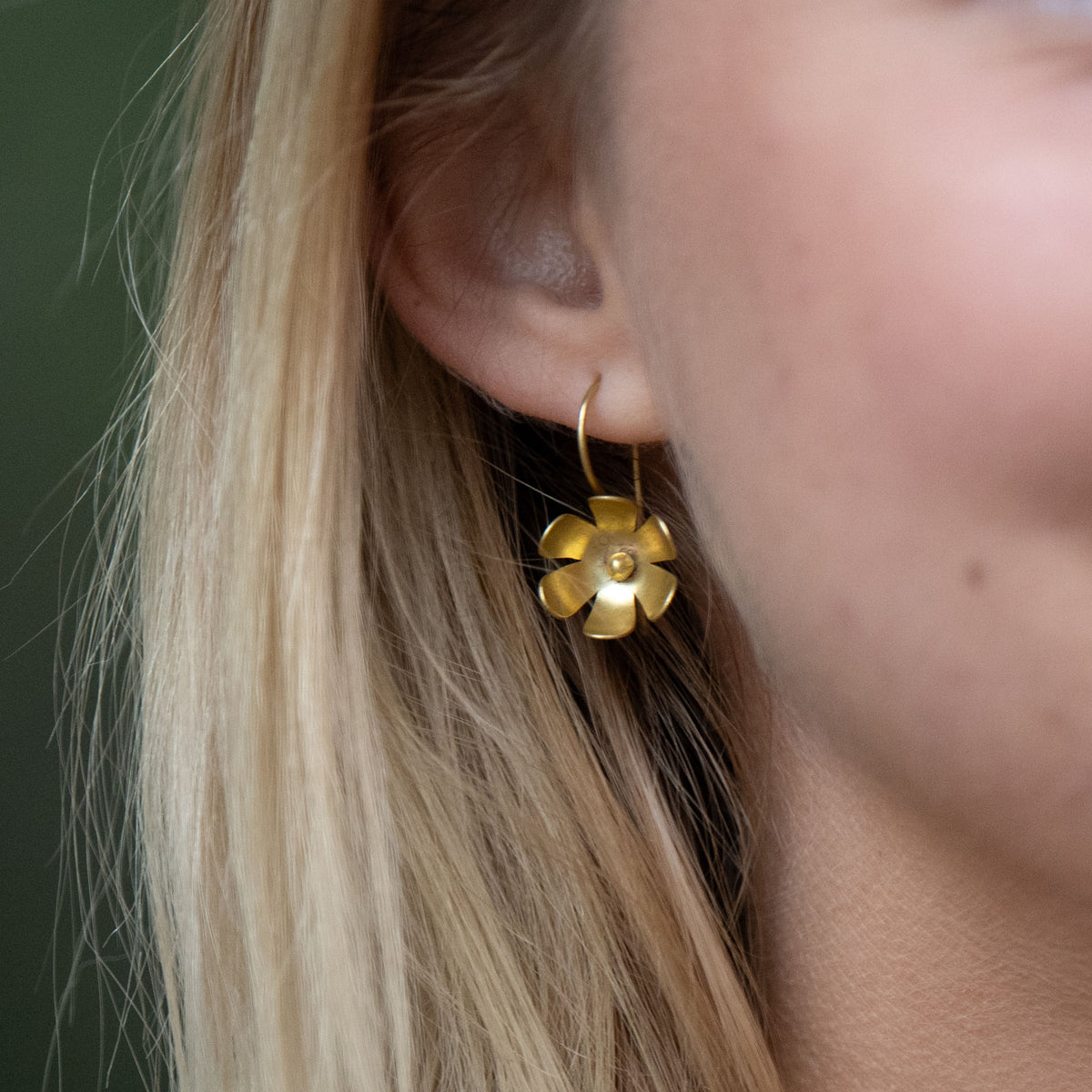 In Victorian floriography, buttercups symbolize childlike joy, innocence, and resilience. Each buttercup is carefully hand-cut and shaped with love, creating earrings that bring a touch of elegance and brightness to any outfit.

Hand-cut and shaped by a young woman escaping human trafficking in India, your purchase brings hope, dignity, and a brighter future to the artisan through our non-profit, International Sanctuary.