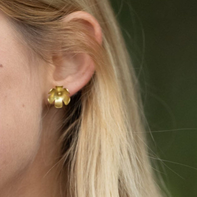 In Victorian floriography, buttercups symbolize childlike joy, innocence, and resilience. Celebrate warmer days and a carefree spirit with these hand-shaped brass earrings, finished with sterling silver posts for everyday comfort.

Hand-cut and assembled by women escaping human trafficking in India, each pair carries a story of courage and renewal, bringing hope, dignity, and a brighter future to the artisan through our non-profit, International Sanctuary.