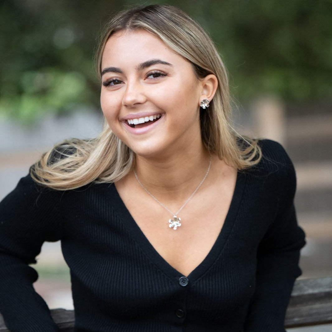 In Victorian floriography, buttercups symbolize childlike joy, innocence, and resilience. Celebrate warmer days and a carefree spirit with these hand-shaped brass earrings, finished with sterling silver posts for everyday comfort.

Hand-cut and assembled by women escaping human trafficking in India, each pair carries a story of courage and renewal, bringing hope, dignity, and a brighter future to the artisan through our non-profit, International Sanctuary.