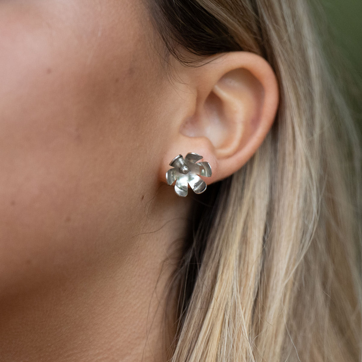 In Victorian floriography, buttercups symbolize childlike joy, innocence, and resilience. Celebrate warmer days and a carefree spirit with these hand-shaped brass earrings, finished with sterling silver posts for everyday comfort.

Hand-cut and assembled by women escaping human trafficking in India, each pair carries a story of courage and renewal, bringing hope, dignity, and a brighter future to the artisan through our non-profit, International Sanctuary.
