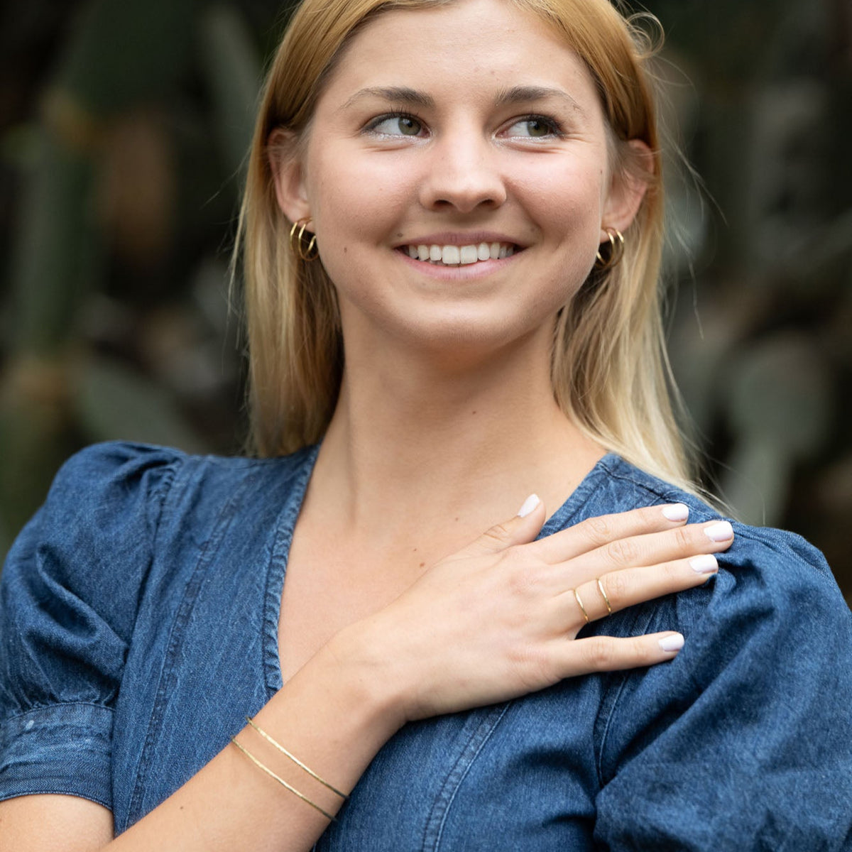 Chloe Huggies earrings, brass and silver, handmade by survivors of trafficking