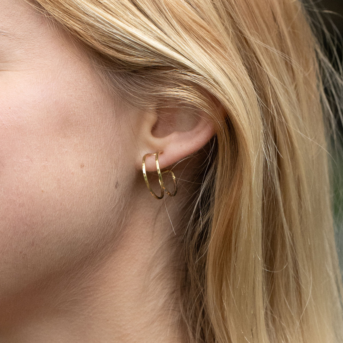 Chloe Huggies earrings, brass and silver, handmade by survivors of trafficking