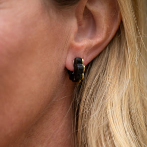Bring a touch of charm to your style with our Daisy Huggie Ankole Earrings. Designed to gently “hug” your ears, these sweet blooms are handmade in brass with a satin-brushed finish, sterling silver posts, and ankole blooms carefully adhered to the brass.