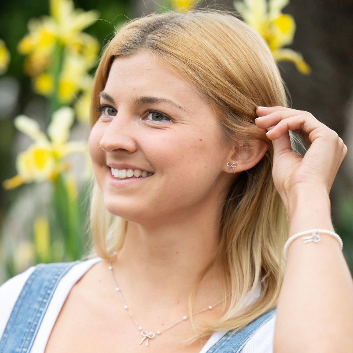 Simple yet meaningful, these dainty hand-forged bows are perfect for everyday wear. Symbolizing resilience and strength, the bow serves as a reminder of lives beautifully tied together through hope and freedom. Each stud is carefully shaped by hand and finished with sterling silver posts for comfort and durability.

Hand-cut, hammered, and assembled by a young woman in India rebuilding her life after human trafficking, every pair carries her story of courage and dignity. Your purchase supports her journey 