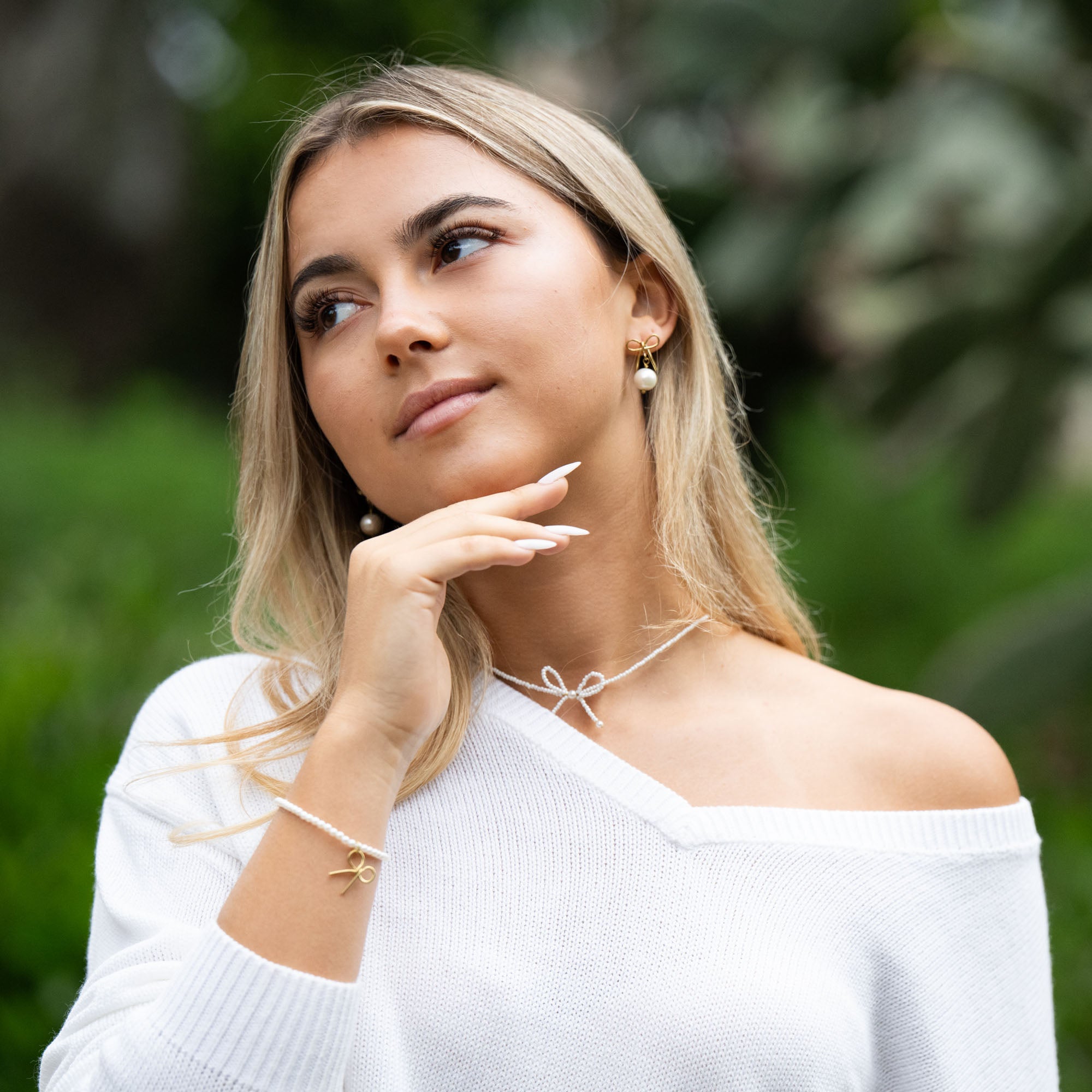 Delicate and timeless, the Pearls & Bow Bracelet features a hand-shaped brass bow paired with dainty faux pearls, creating a piece that adds elegance and charm to any look. The bow symbolizes resilience and the strength of lives beautifully tied together.

Handcrafted by a young woman escaping human trafficking in India, each bracelet carries a story of hope, dignity, and new beginnings. Your purchase supports her journey through our non-profit, International Sanctuary.