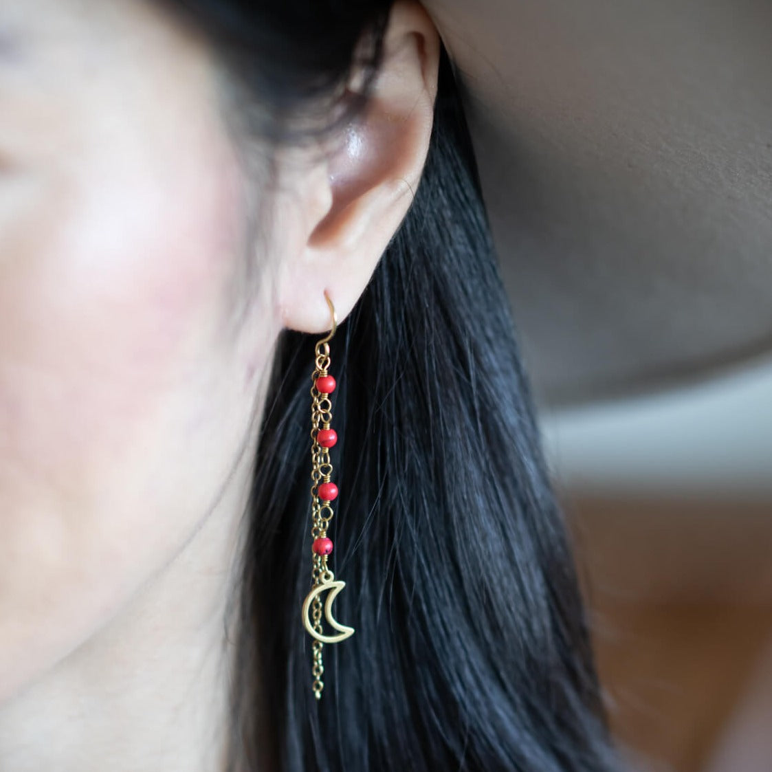 orange beads with moon charm earrings
