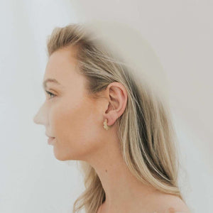 Daisy Earrings worn on a PURPOSE jewelry model